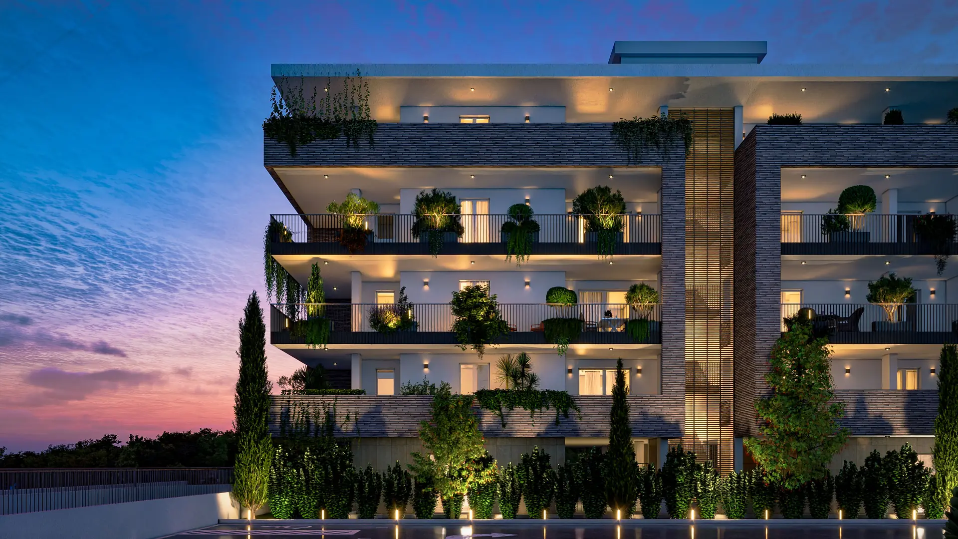 Il complesso residenziale Quiet al crepuscolo, con logge illuminate e fioriere sui terrazzi